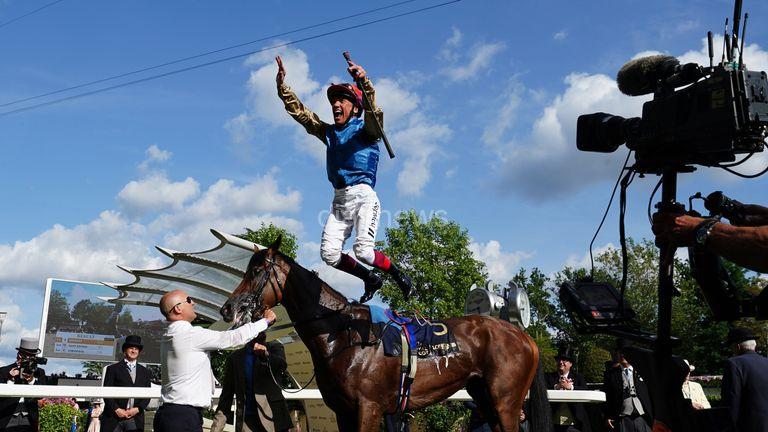 Frankie Dettori performs his famous flying dismount celebration after Gregory&#39;s success in the Queen&#39;s Vase
